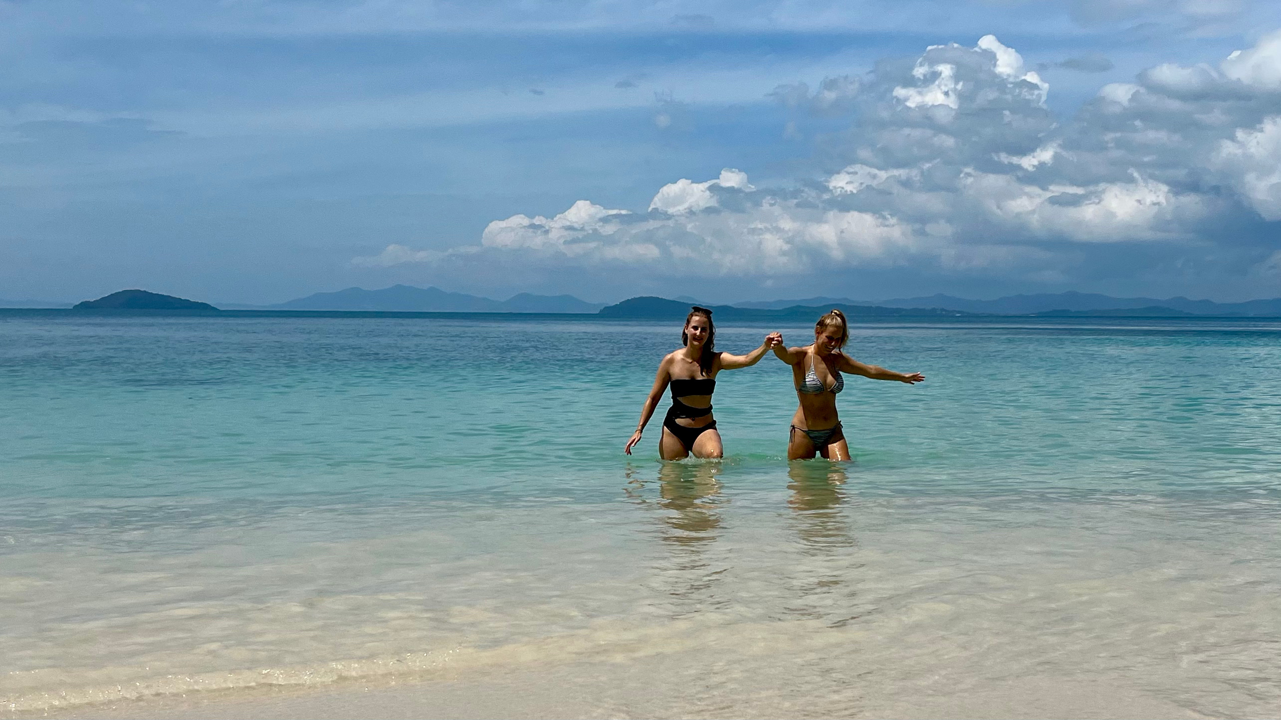 Guests swimming around the boat in a lagoon